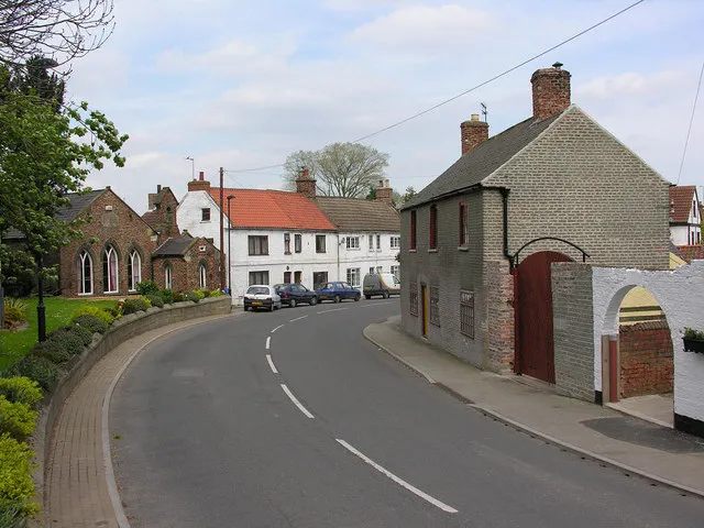 Main Street, Airmyn in the East Riding of Yorkshire, England.A view of the main street where it curves away from the banks of the River Aire towards the north end of the village.