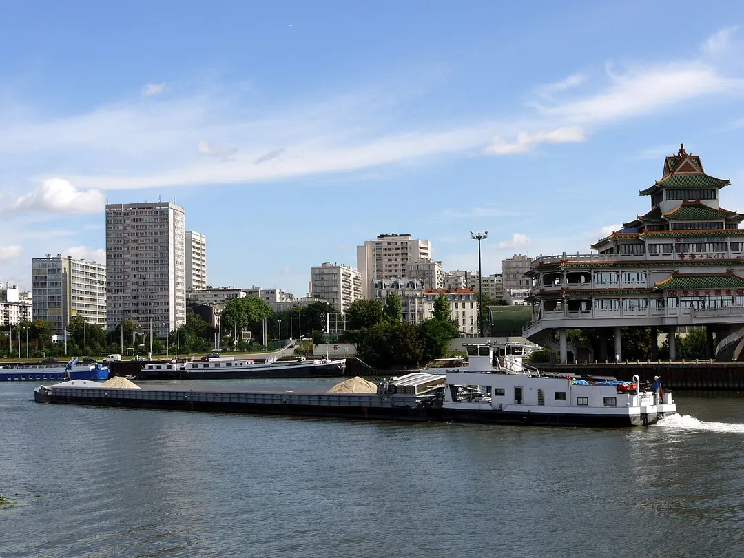 Barge and tugboat on the river Seine near Paris