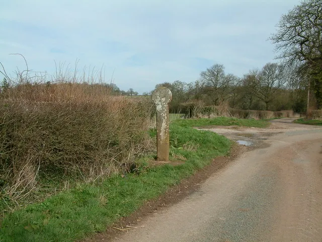 Buttercross, Alveley The cross is marked faintly on the round stone at the head.
Pevsner says it "probably marks the site of an ancient open-air market", but according the local historical society states that it may be where butter and other comodities were left for the villagers to collect during time of plague.