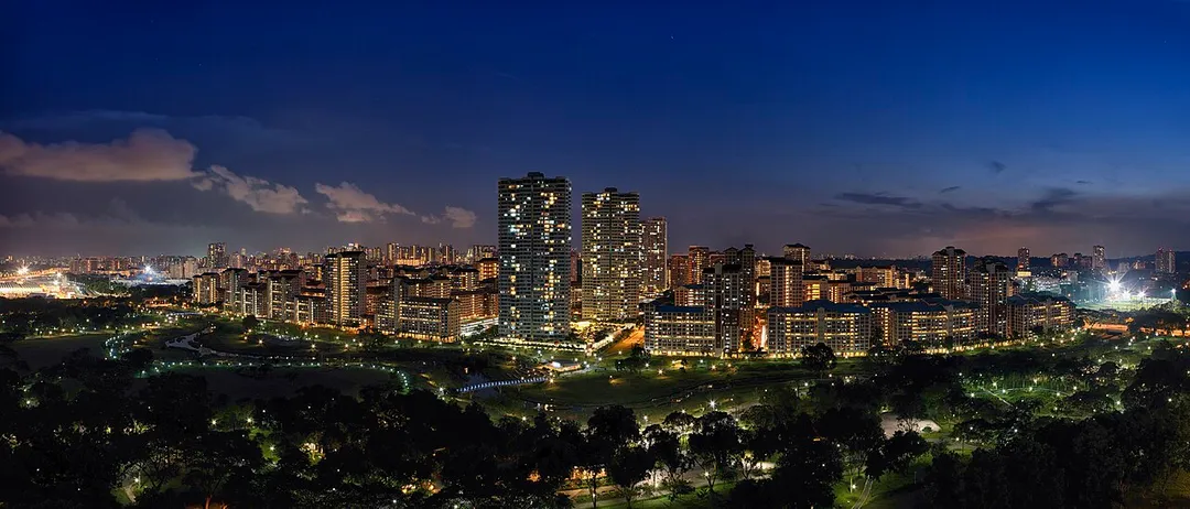 A panorama photograph of Bishan–Ang Mo Kio Park and Ang Mo Kio, Singapore at night.