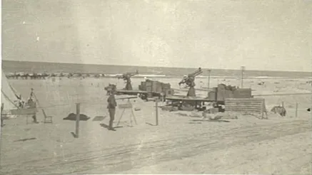 AWM caption : "Mounted anti-aircraft guns at an Australian Light Horse camp beside the seaside at El Arish."

Comment : The guns are QF 13 pounder 6 cwt. They have an additional oil reservoir mounted at the end of the recuperator housing above the barrel, which was unusual for 13 pounders.