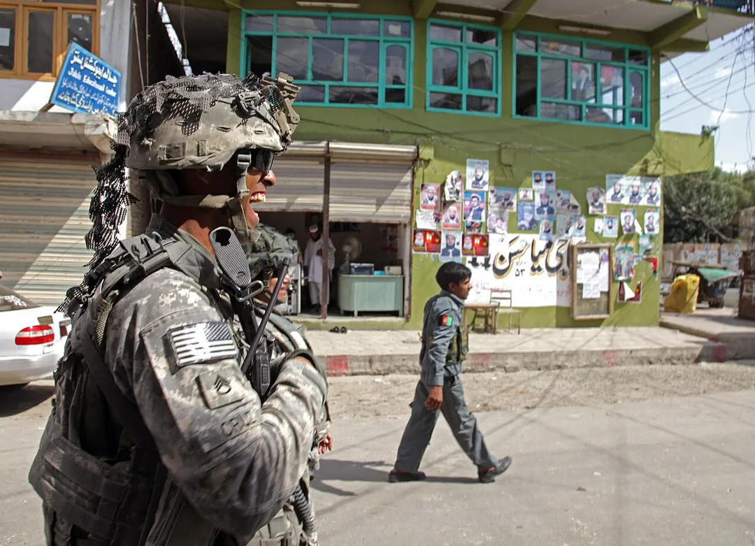 U.S. Army Staff Sgt. Michael Cruz, of Cortland, N.Y., conducts a patrol with Afghan national security forces through the streets of Asadabad city in eastern Afghanistan's Kunar province, Aug. 19. Cruz is deployed with the 1st Battalion, 32nd Infantry Regiment, 3rd Brigade Combat Team, 10th Mountain Division, which is currently serving as part of Task Force Mountain Warrior. (Photo ID: 197694)