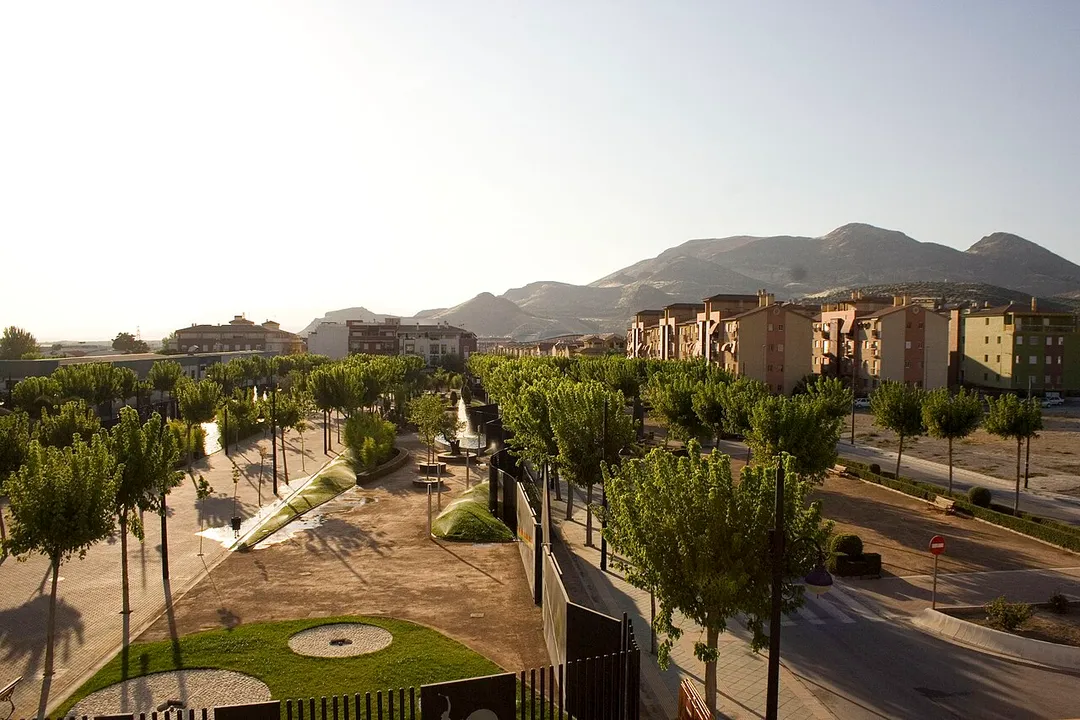 The view of Atarfe town showing the park dedicated to Pink Floyd and the mountains.