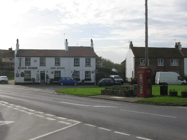 Atwick, East Riding of Yorkshire, England.Looking west across the B1242 to the village green at Atwick.