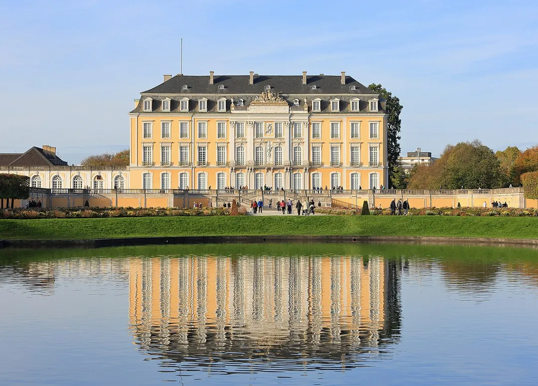 The southern facade of Schloss Augustusburg. The Augustusburg and Falkenlust Palaces form a historical building complex in Brühl, North Rhine-Westphalia,  Germany, which has been listed as a UNESCO World Heritage Site since 1984. The buildings are connected by the spacious gardens and trees of the Schlosspark.
