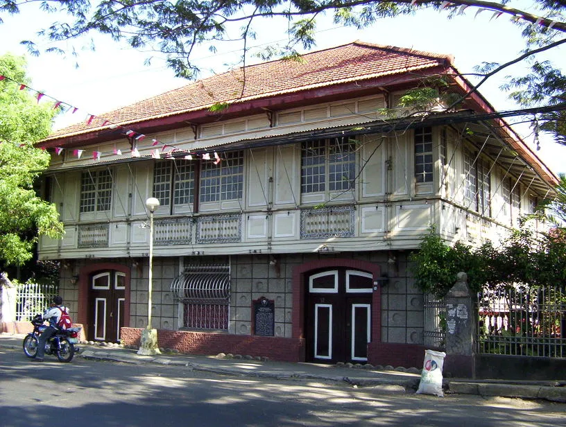 Photo of the house that served as the headquarters of the Philippine revolutionary government under General Emilio Aguinaldo, warranting the fact that Bacoor became the capital of the Philippines following the 1898 Declaration of Independence by Aguinaldo.  On July 4, 1898, Bacoor became the main headquarters and capital of the Revolutionary government. The residence of Juan Cuenca and Candida Chaves in Digman was the First Malacañang of the Republic of the Philippines. It is located along General Evangelista Street in Barangay Digman, Bacoor.  User reyrefran contributed to this.
