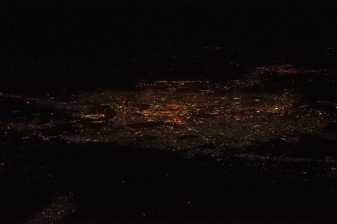 Bagdad in Iraq at night. View from East; height, 35,000 feet; distance, 95 miles