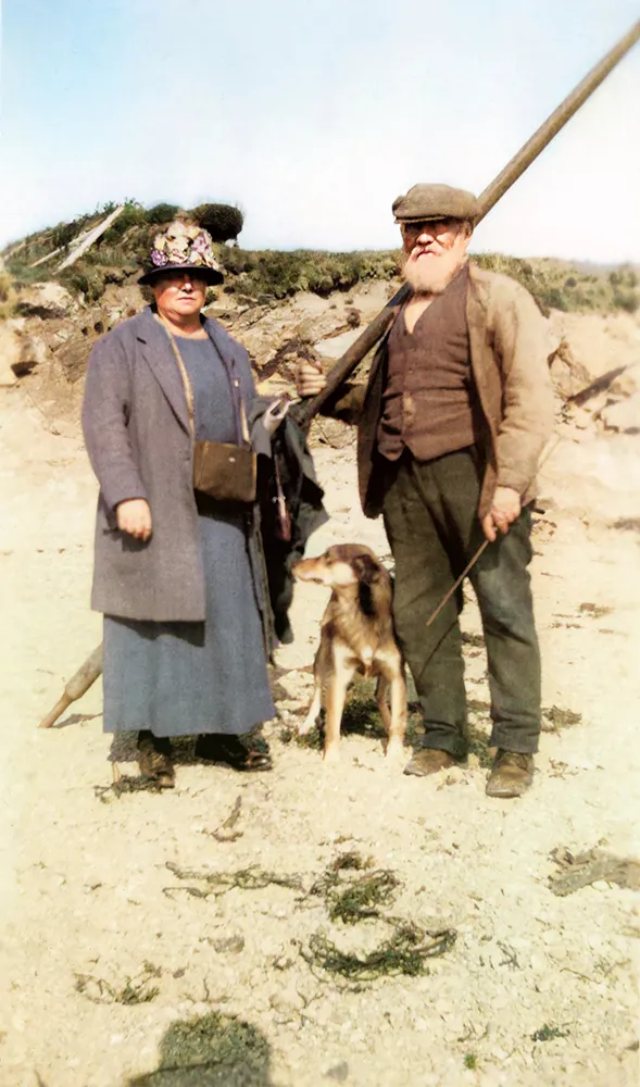 Photograph of Love Pritchard (Bardsey King) with an unknown person and dog, c.1915.
Image repaired and coloured by Welsh artist, Rhŷn Williams.
