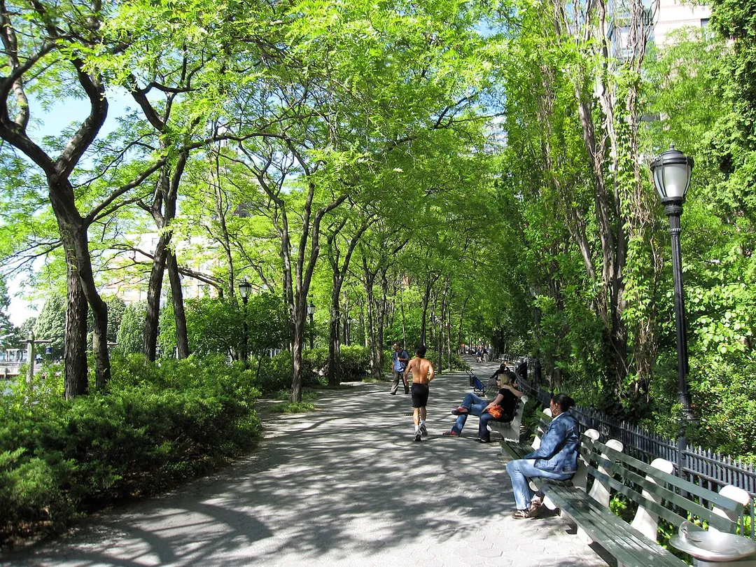 Park benches and walkway — Battery Park City.