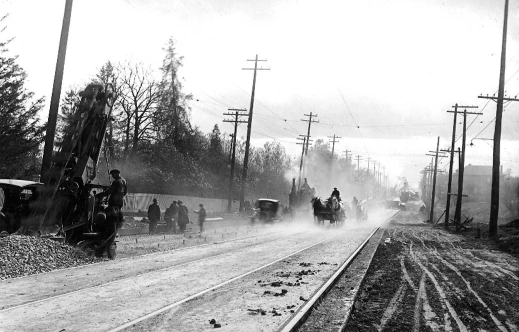 Construction of streetcar tracks on Yonge Street, at Lawrence Avenue, looking north (Toronto, Canada}
