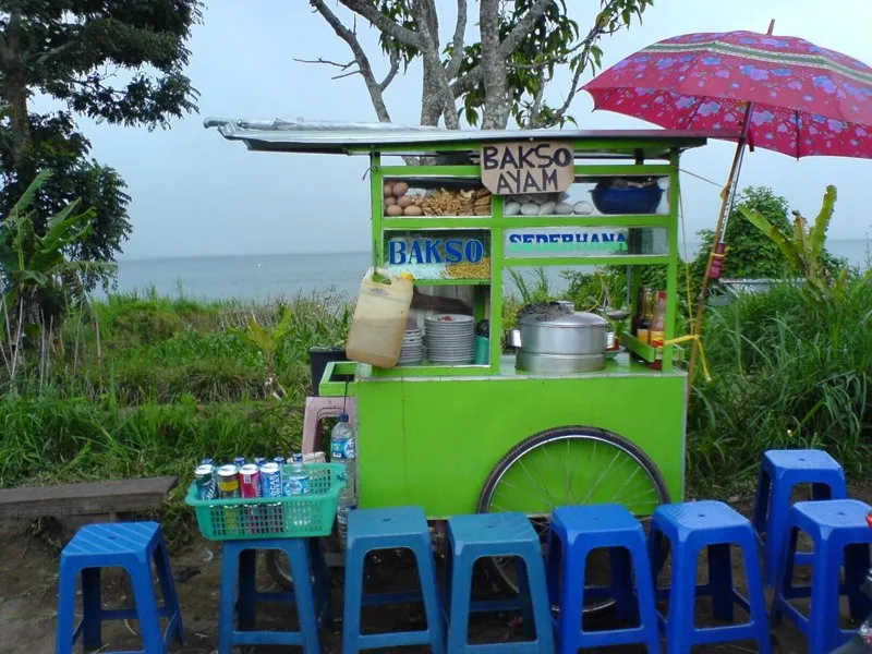 Bedugul is located by the crater lake Tamblingan in Bali, Indonesia. It is a pilgrimage destination for the island's Hindus and a popular spot for picnics. Hence the many colorful food stalls.
