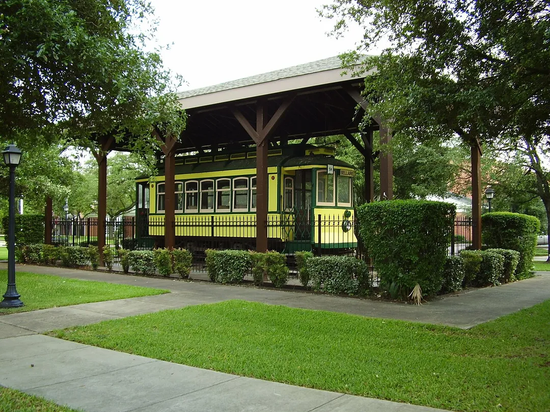 The historic Bellaire streetcar at Paseo Park. Now numbered 124, it is former Porto, Portugal car 173, built in Porto in 1929 but based on streetcars the Porto streetcar system had previously purchased from Philadelphia-based J.G. Brill Company in the early 20th century – and similar to streetcars that operated in Bellaire. It was imported from Portugal in 1985 by Oregon-based streetcar importer Gales Creek Enterprises, restored and placed on display in Bellaire in autumn 1985.  It was renumbered 124, in honor of a streetcar that had run on the former Bellaire system.