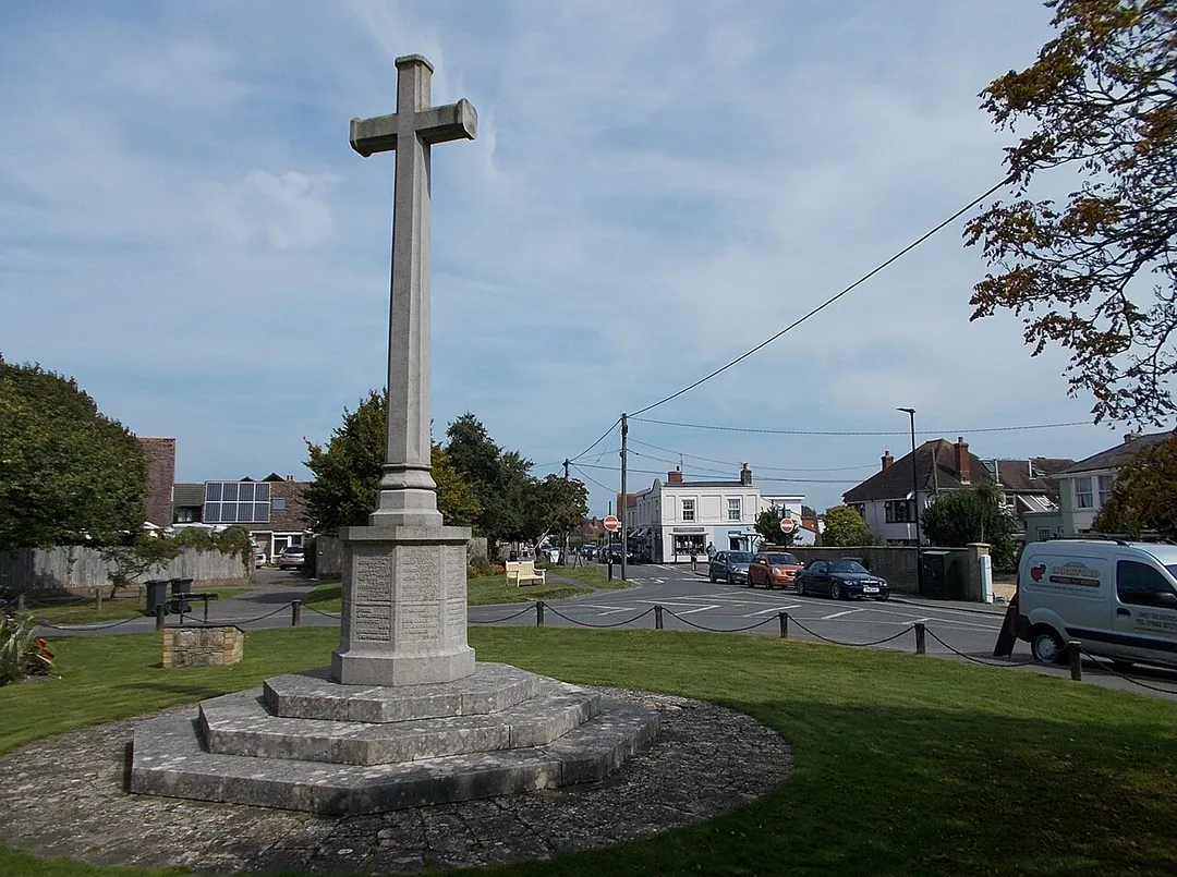 Village centre, Bembridge, Isle of Wight, UK, with the war memorial in the foreground