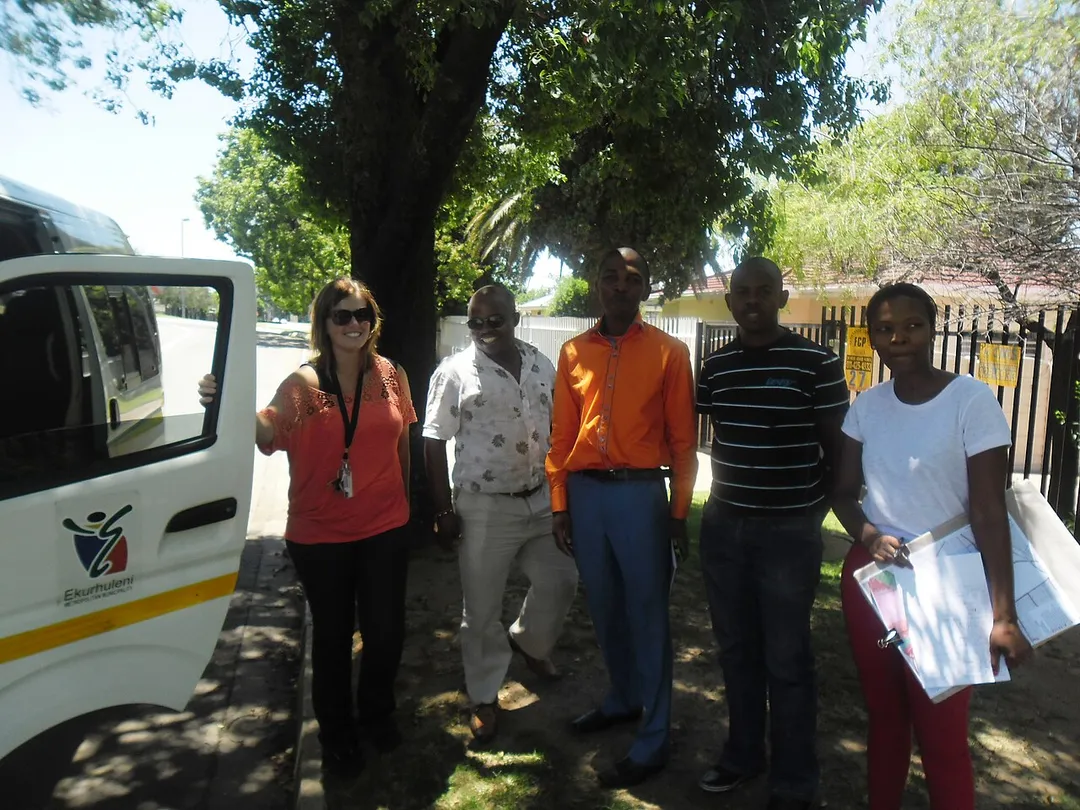 Officials from the Town Planning department of the Ekurhuleni Metropolitan Municipality (South Africa) on a routine site visit in the Benoni. The municipal planning team's composition is a reflection of the"New South African" racial integration policies