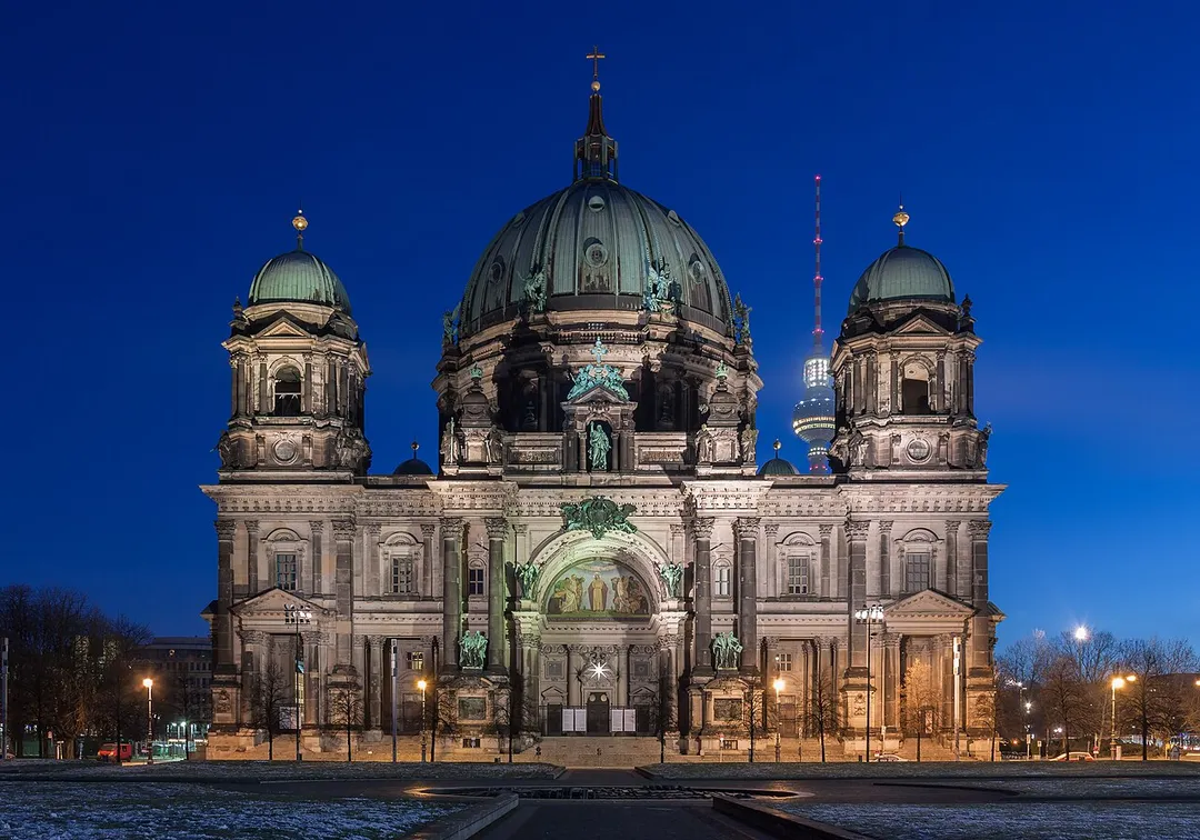 The west front of the Berlin Cathedral in the early morning at the blue hour.