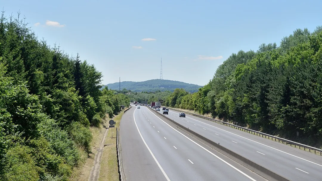 Highway A3 (Luxembourg) as seen from the footbridge at Bettembourg. In the background: the RTL Radio Tower Dudelange.