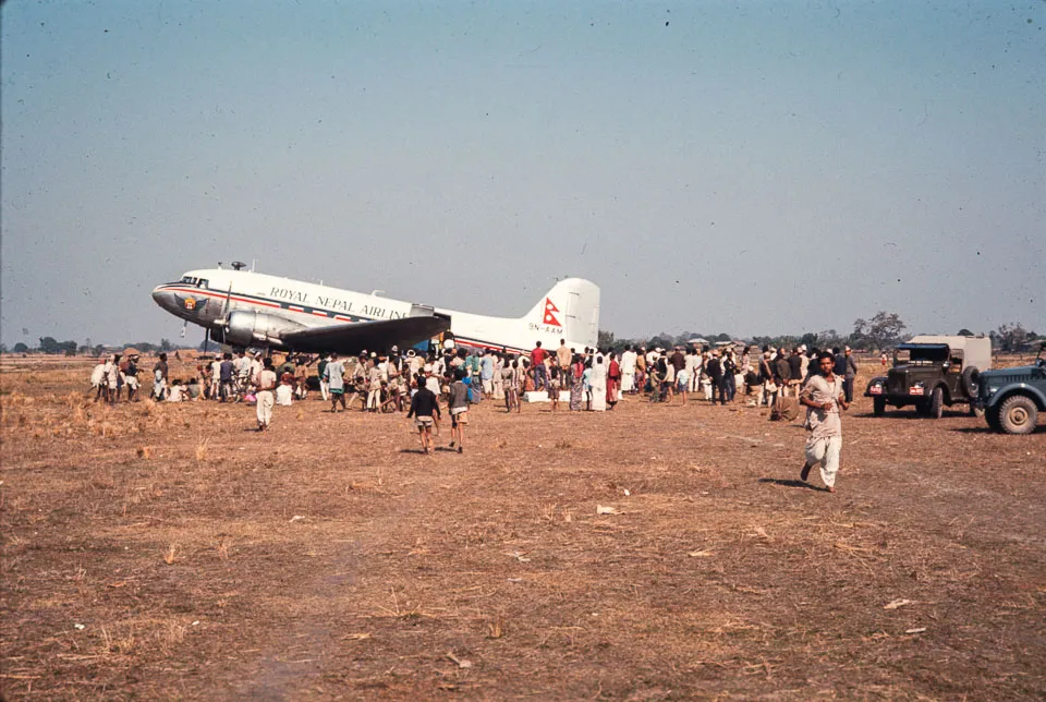 Date: 1967 Location: Bhadrapur, Jhapa Description: RNAC DC-3 loading at Bhadrapur airport.
