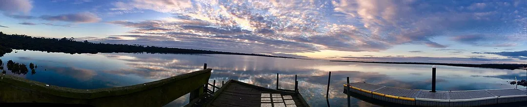 Panoramic image taken of the shore in the Blind Bight Nature Reserve at dawn.