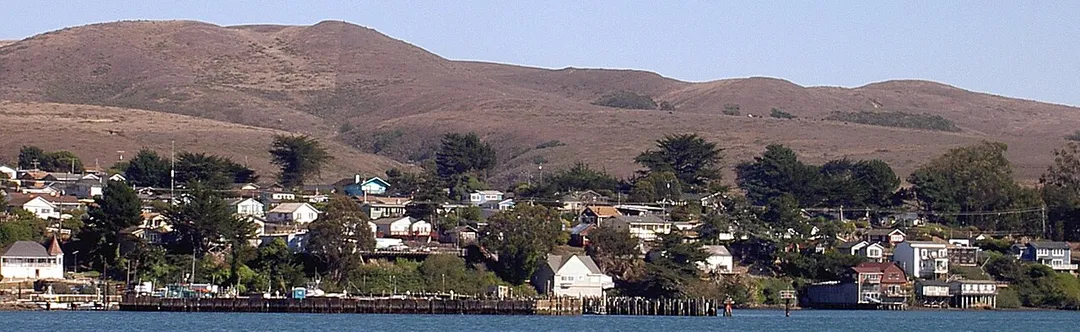 town of Bodega Bay as seen from Bay Flat Road north of Spud Point Marina, rotated and cropped using Adobe Photoshop Elements