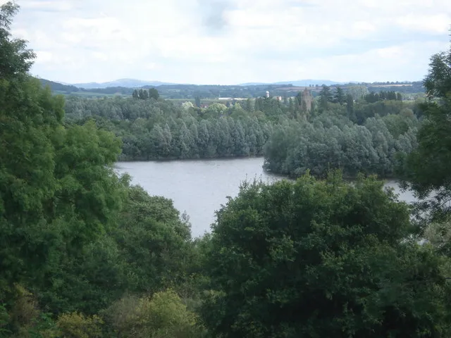 Bodenham gravel pits View across the flooded pits to the Bodenham church tower, with the Malvern Hills on the horizon to the left.
