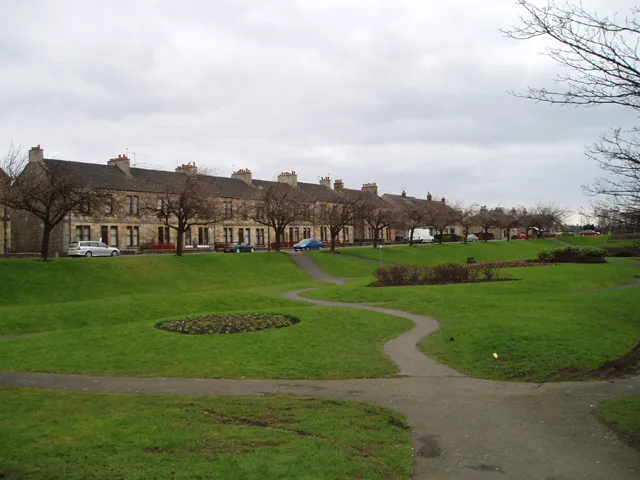 Bonnybridge Terraces. These 19th Century houses beside a picturesque park in the heart of this industrial town which lies on the Bonny Water. The town developed in the 19th century in association with a Saw Mill and Paper Mill and Iron Foundries which used the river and the nearby Forth and Clyde Canal.