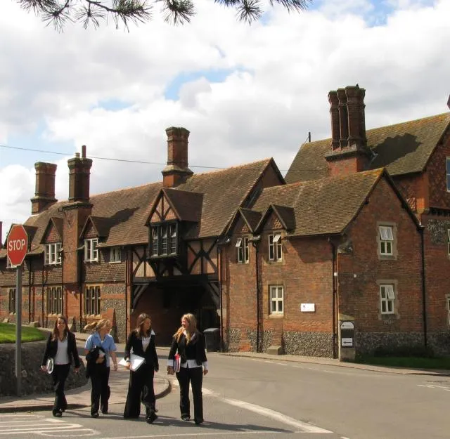 The cross roads in the centre of the village of Bradfield, Berkshire, England. The buildings in the background are part of Bradfield College. For more information see the Wikipedia articles Bradfield, Berkshire and Bradfield College.