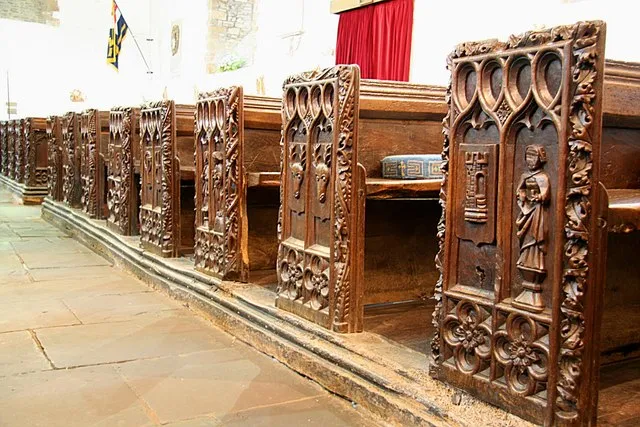 Braunton's famous pews Some of the 46 sixteenth century pews in St.Brannock's church .... a castle &amp; saint, a pair of stags heads etc.