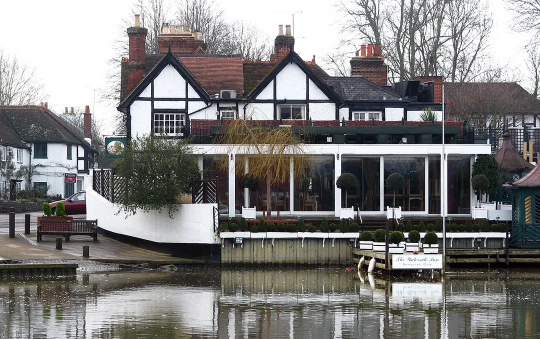The Waterside Inn on the River Thames at Bray in Berkshire showing the patron's landing stage.