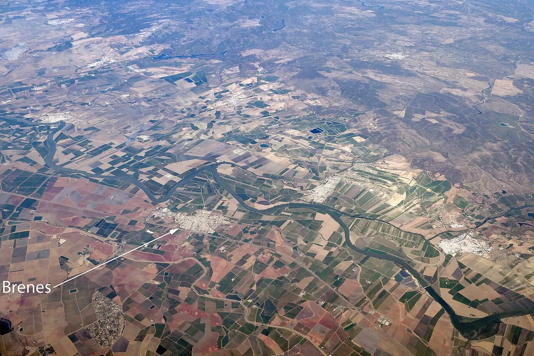 An aerial view of Brenes in Andalusia, Spain, and the countryside around it.