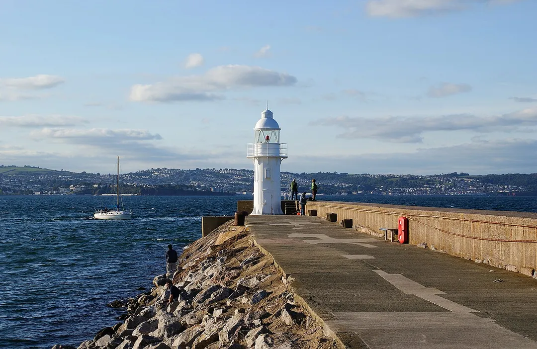 Lighthouse at the end of the Breakwater at Brixham in Devon, UK.