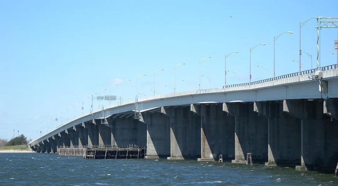 Looking north at Cross Bay Bridge from behind school on a sunny midday.