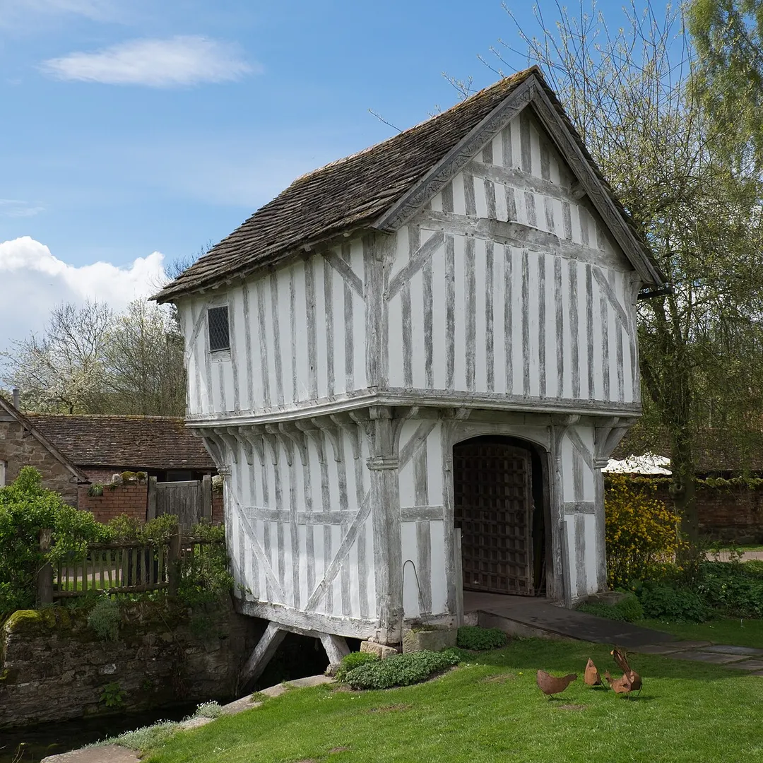 Late 15th century Brockhampton Estate gatehouse straddling the moat. A grade I listed building in Herefordshire.