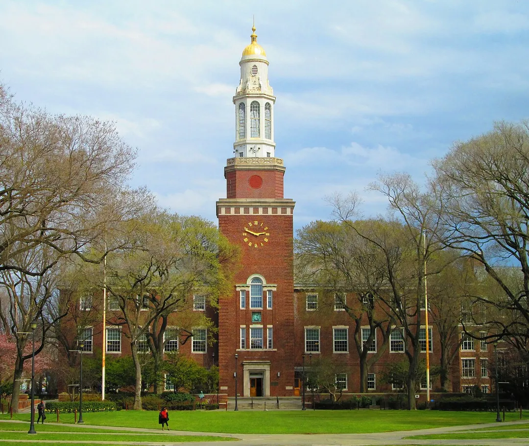 Brooklyn College is a senior college of the City University of New York, located in the Midwood neighborhood of Brooklyn, New York City. The origin of Brooklyn College occurred in 1910 with the establishment of an extension division of the City College for Teachers. The school then began offer evening classes for first-year male college students in 1917. In 1930 by the New York City Board of Higher Education, the College authorized the combination of the Downtown Brooklyn branches of Hunter College – at that time a women's college – and the City College of New York – a men's college – both of which had established been in 1926.  With the merger of these branches, Brooklyn College became the first public coeducational liberal arts college in New York City. The college's 26-acre (110,000 m2) campus is known for its beauty, and is often regarded as "the poor man's Harvard" because of its low tuition and reputation for respectable academics.  The master designer of the original Georgian style campus, now known as the "East Quad", was Randolph Evans.