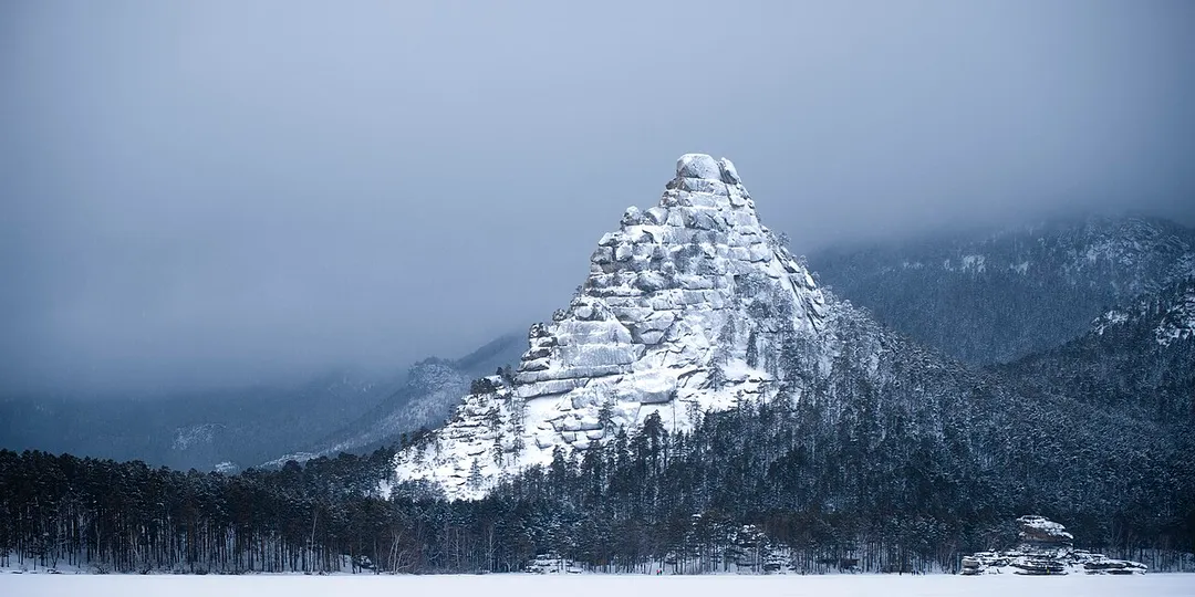 A rocky outcrop rising above the forest in Burabay National Park. Kokshetau Mountains, Burabay District, Aqmola Region, Kazakhstan