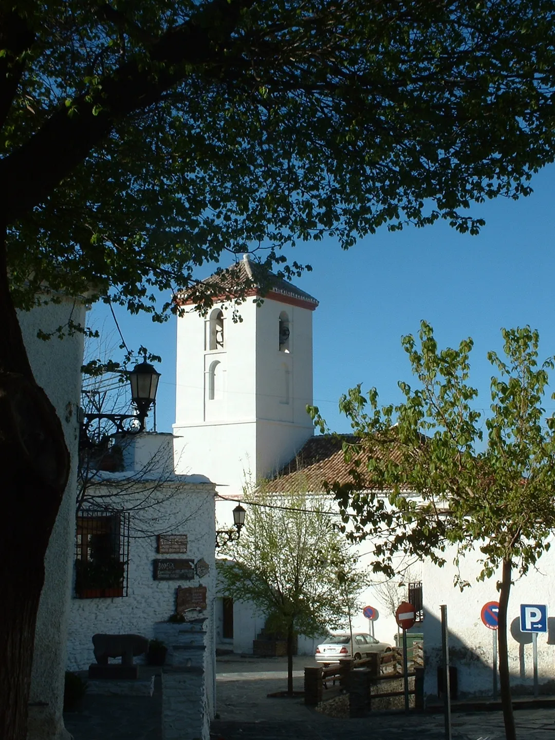 Capileira, in Las Alpujarras, Granada, Spain: the village church from the terrace of the bar "El Tilo"