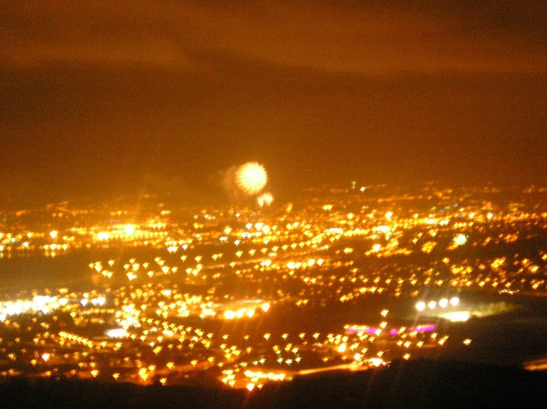 The view of Belfast from Carnmoney Hill (fireworks form the New Years celebrations can clearly be seen in the skies above Belfast's Odyssey Arena)