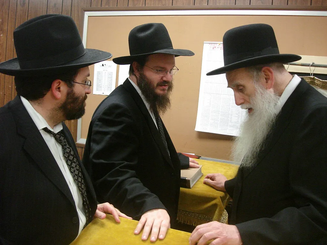 Rabbis Brown and Mayer talking with Rabbi Aharon Feldman