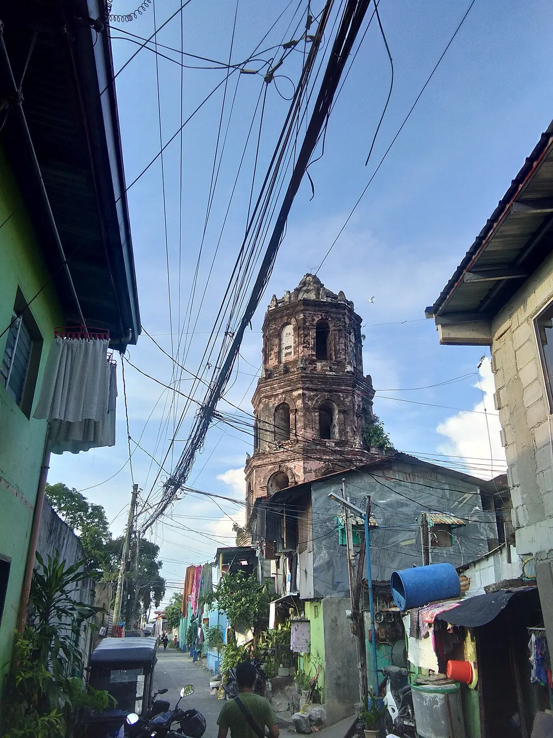 The Spanish Era belfry ruins of a former Augustinian Recollects,  Church of Santa Monica build in 1616 and was bombarded during the Second World War in 1945. This structure was the only two surviving ruins with the ruins of the Church of San Juan de Dios and remained intact after the war and all other five churches inside the ancient walled city of Cavite Puerto was completely destroyed.
