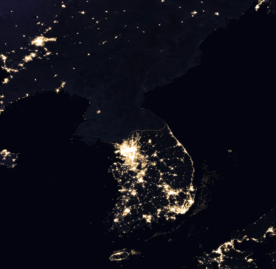 Earth at Night: Flat Maps. Satellite picture displaying the Korean peninsula at night.