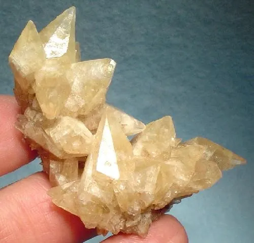 Calcite
Locality: Nkana Mine, Chambishi-Nkana Basin, Kitwe, Copperbelt Province, Zambia (Locality at mindat.org)
Size: 5.3 x 4.2 x 2.2 cm.
An aesthetic, two-sided cluster of glassy, translucent, amber, dogtooth calcite crystals from a mostly unknown locality - the Nkana Mine of Zambia. Calcite is VERY UNCOMMON from Nkana and this is a GOOD one. Ex. Marty Lewadny Collection and in pristine condition.