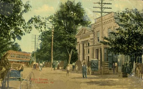 Photographic view looking north on Main Street, Chatham, Pittsylvania County, Virginia, in 1909.  Chatham Savings Bank is on the corner, and the Post Office and drug store are on the right.