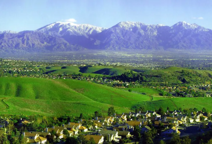 The Chino Hills (landform) and skyline of Chino Hills (city) — with the Pomona Valley beyond and the San Gabriel Mountains rising in the background.
Located in San Bernardino and Los Angeles Counties, Southern California.