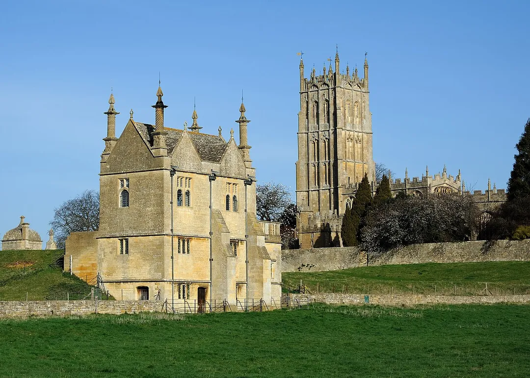 The gate and East Banqueting House of Campden Court and St James's Church in Chipping Campden