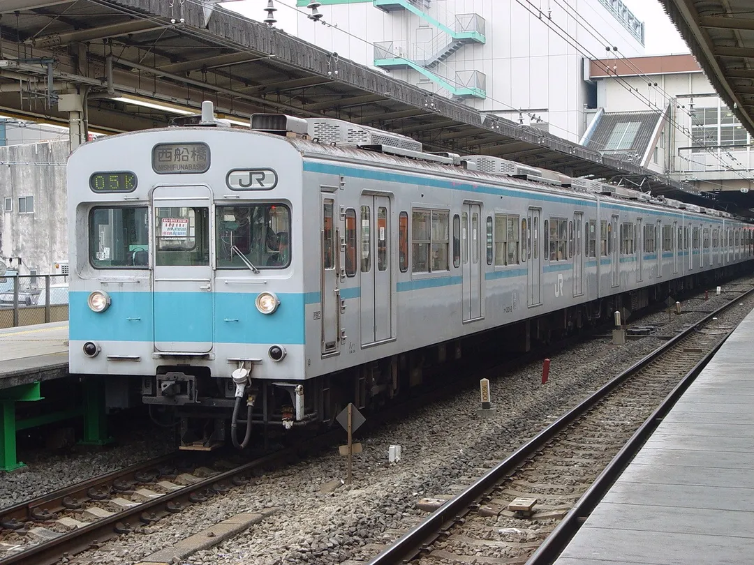 JR East 301 series set K5 at Mitaka Station on a Tozai Line through-running service