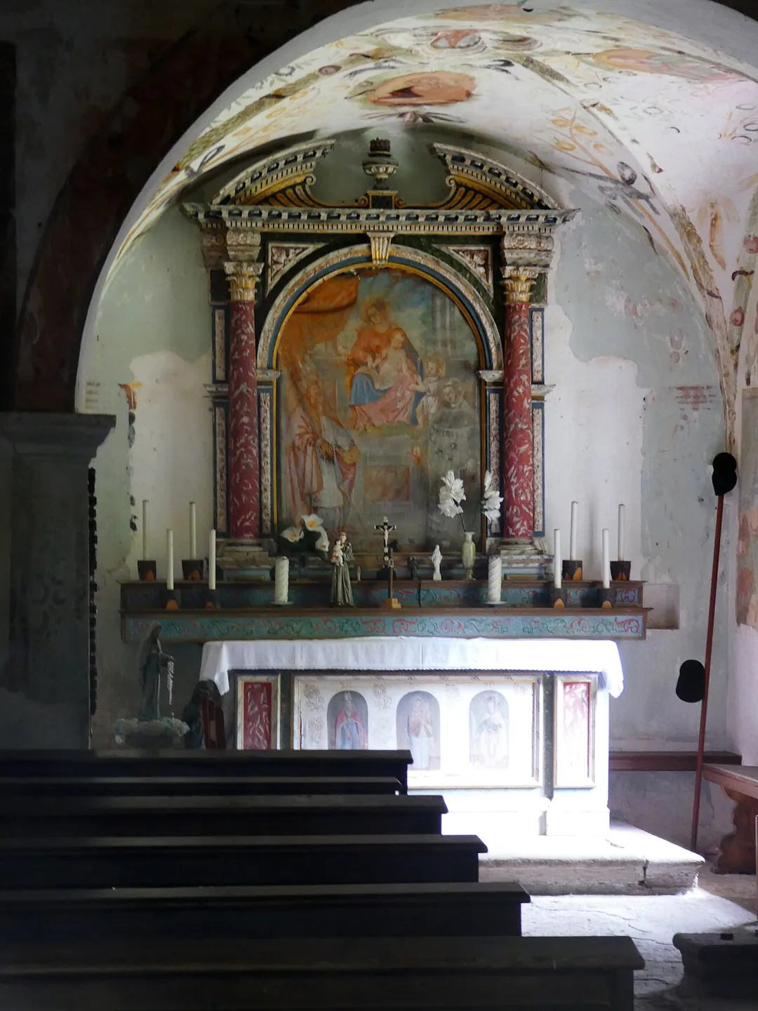 Late-16th-century wooden altar in the church of San Martino, in the San Martino Valley at Feltre, Veneto, Italy. The altarpiece, dated 1762, depicts the Madonna and Child, the infant Saint John the Baptist, Saint Martin of Tours and Saint Anthony of Padua.