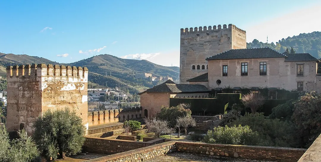 Granada, Spain: The Comares Palace, seen from Alhambra and Sierra Nevada, seen from the square of the cisterns