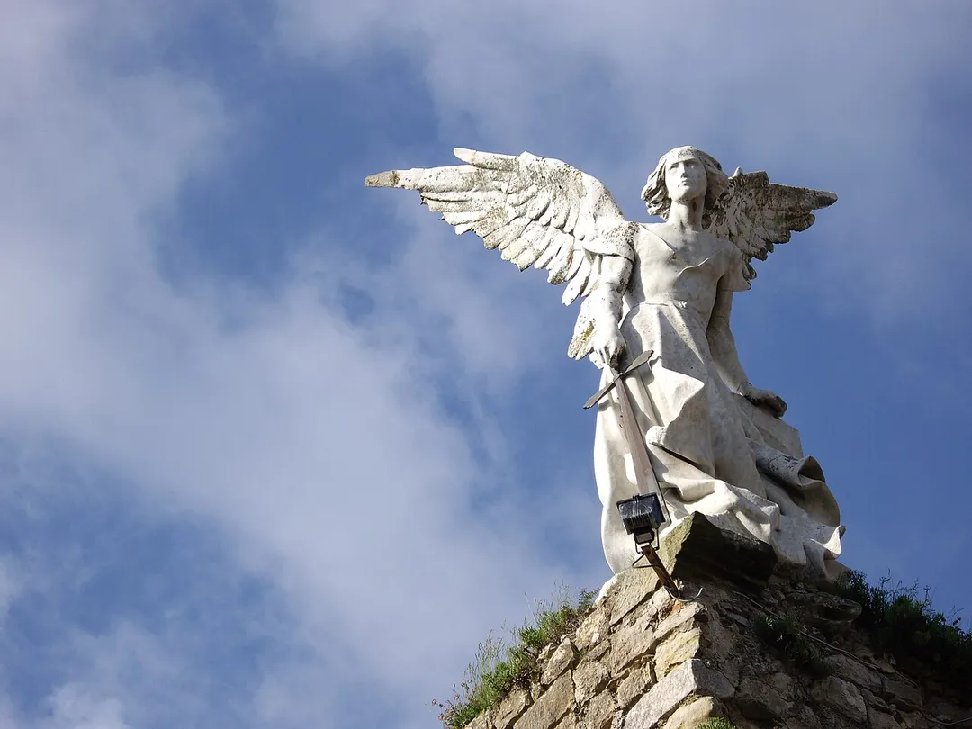 Guardian Angel, sculpture by Josep Llimona. Modernist style, around 1894-1895. It's erected over the walls of an old ruined Gothic church in Comillas (Cantabria, España).