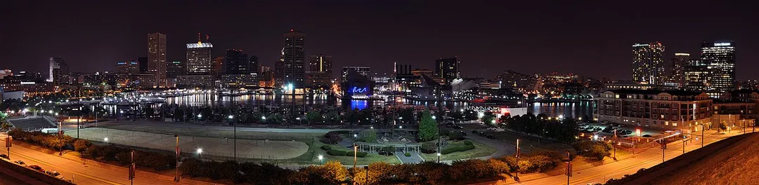 A four segment panorama of Baltimore's Inner Harbor skyline taken at night from Federal Hill.