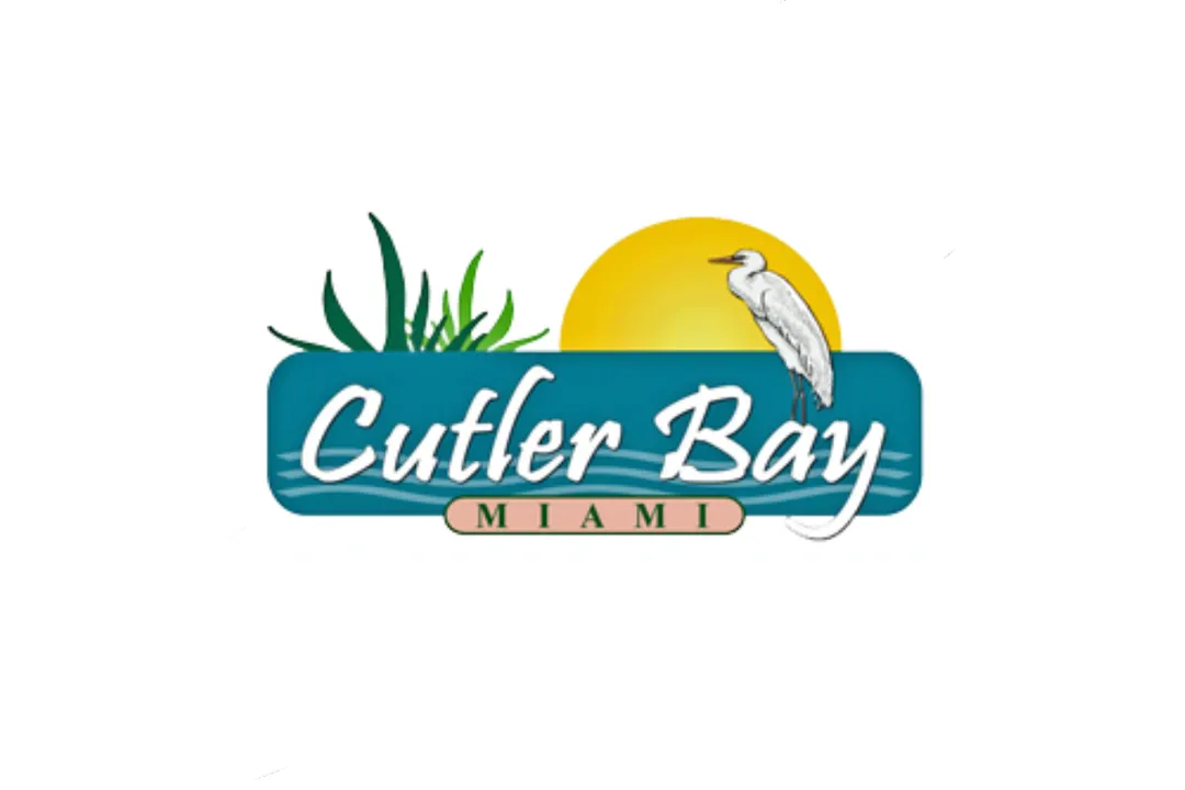 “ The Town of Cutler Bay (24,781 inhabitants in 2000; 1,260 ha), located in Miami-Dade County, is named after Dr. William C. Cutler, a surgeon from Chelsea, Massachusetts, who bought 600 acres from the "Big Hunting Ground", parts of the Perrine Grant awarded to Dr. Henry Perrine in 1838. The first permanent resident in the place was William Fuzzard, who built a home in 1883 and cut a path through the wilderness, later widened to a wagon trail. Declared a public road in 1895, the Old Cutler Road was declared a State Historic Highway in 1974 by the Florida Legislature. Organized only in the early 1950s by David Blumberg and Joe Segal, as Cutler Ridge, Cutler Bay was chartered on 8 November 2005 (with effect the next day), following a vote by the residents held in January 2005. The Town of Cutler Bay is therefore the youngest incorporated municipality in Florida.
www.cutlerbay-fl.gov/history.php - Town website
In the "Miami Herald", 22 February 2009, Howard Cohen reports that the Town Council has adopted a town flag on 18 February 2009: 
"The [..] flag -- the town logo on a white background -- was expected to be unfurled Saturday at Cutler Bay's third annual Founder's Day Celebration at Cutler Ridge Park."
www.miamiherald.com/news/miami_dade/pinecrest/story/914507.html - The Miami Herald website
A large image of the town logo is shown on the Miami-Dade County website. The logo shows the sun and green plants over the sea (shown as a blue cartouche with three lighter blue waves) and a heron, and bears the writings "Cutler Bay" (in white letters on the sea), "FLORIDA" (in black letters in a pink cartouche) and "ESTABLISHED 2005" (in blue letters under the cartouche).

www.miamidade.gov/mdpd/BureausDivisions/Unit_Municipal_Services.asp - Miami-Dade County website” - Ivan Sache on CRW flags. Source: https://www.crwflags.com/fotw/flags/us-flcut.html