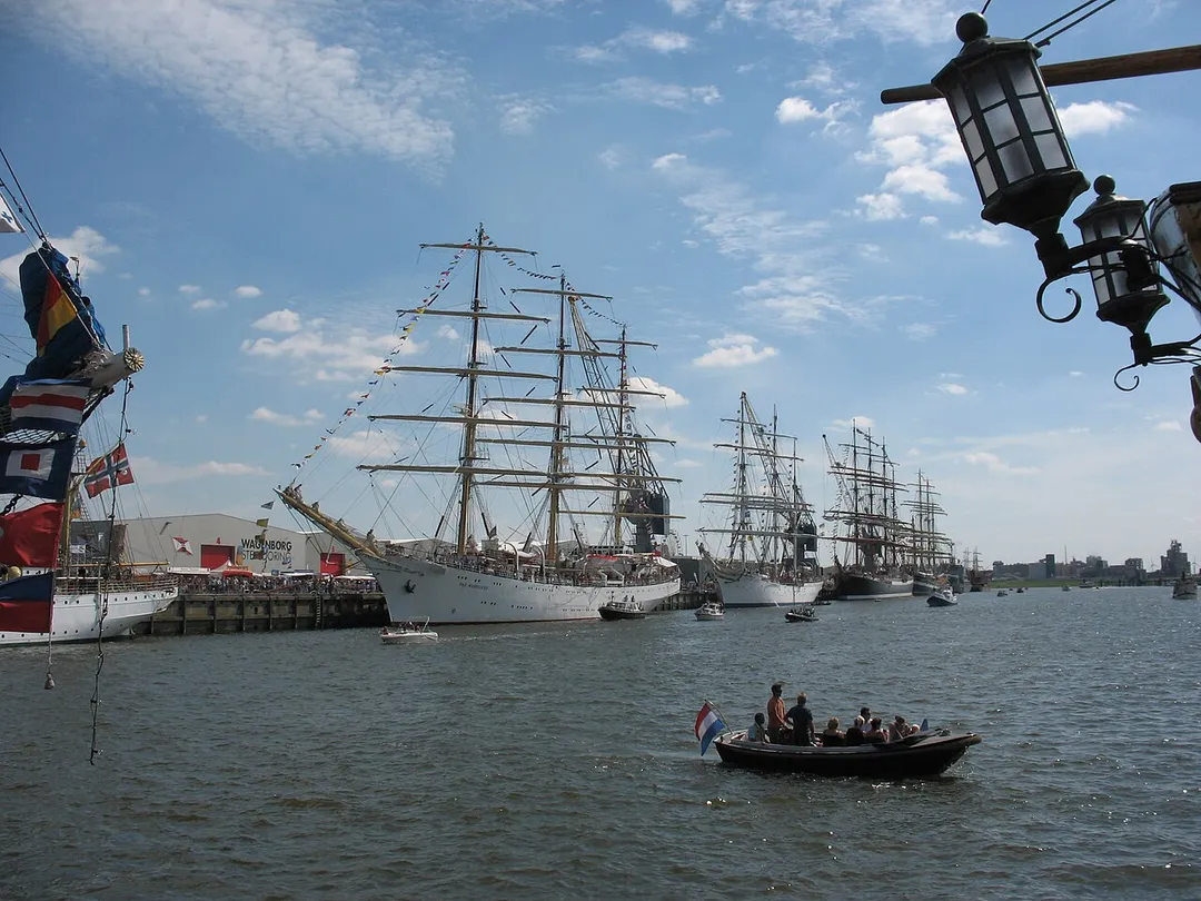 Picture taken during DelfSail, a 5-yearly sail event (the largest one of the Netherlands) in the town of Delfzijl, a town in the northeast of the province of Groningen. I don't know the name of the ship you see in the front, but the lamp on the right is a piece of The Bounty, a pirate ship that was built for the movie Mutiny on the Bounty.